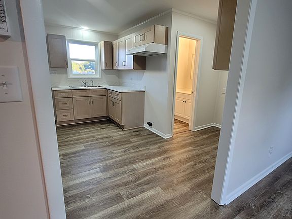 Looking into the kitchen, laundry area toward the bathroom from the Living Room.