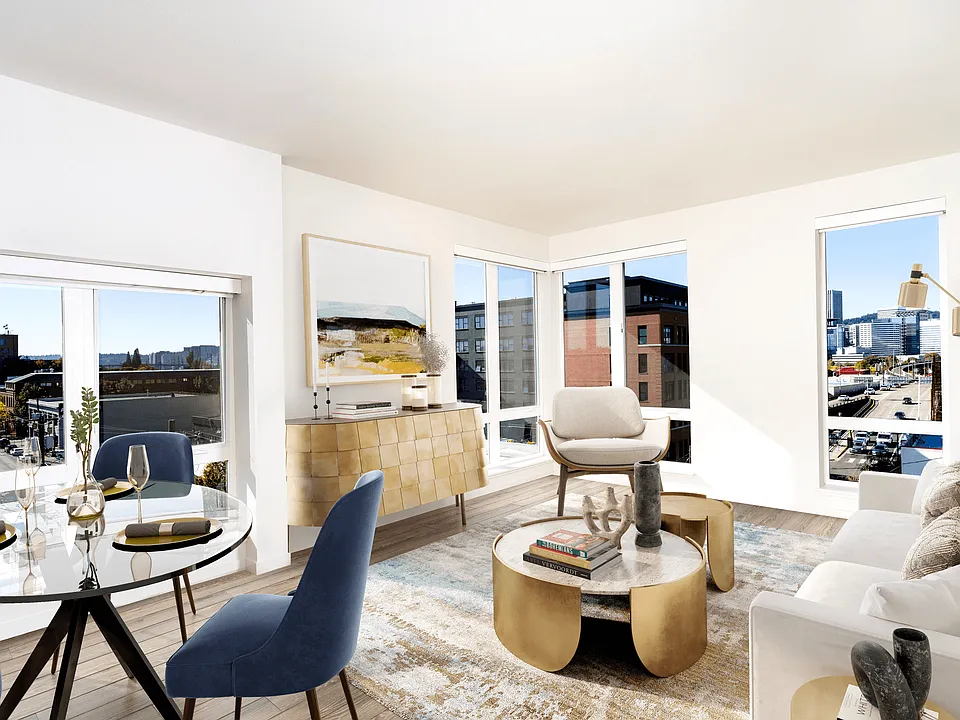 A light-filled living space at Modera Belmont, framed by expansive windows and city views, just steps from Belmont's cafes, boutiques, and local favorites.