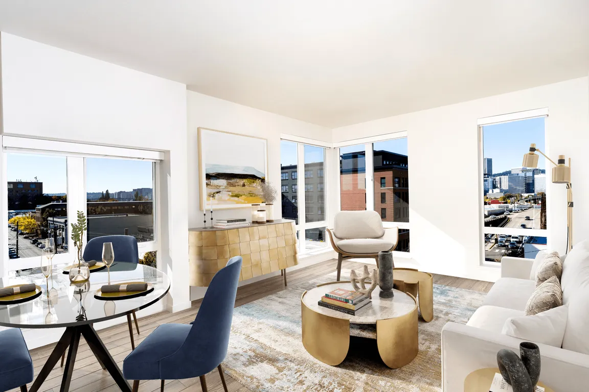 A light-filled living space at Modera Belmont, framed by expansive windows and city views, just steps from Belmont's cafes, boutiques, and local favorites.
