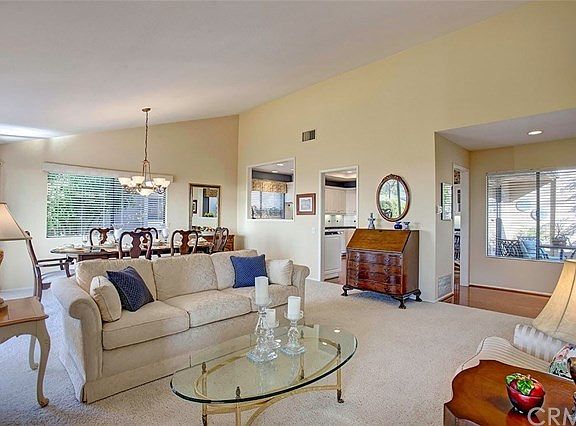 View from living room to dining area and formal entry, on right.