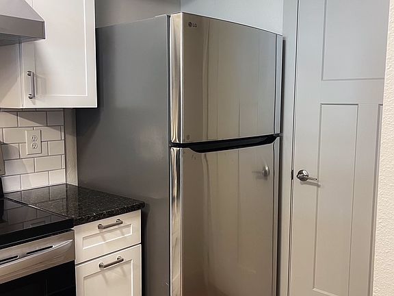 New refrigerator. First Floor laundry behind door.