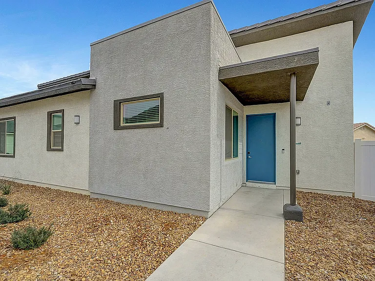 Experience the charm of modern minimalism with this beautifully designed home exterior.