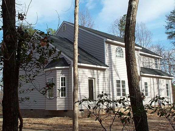 Side rear view on 1.6 Acre lot.