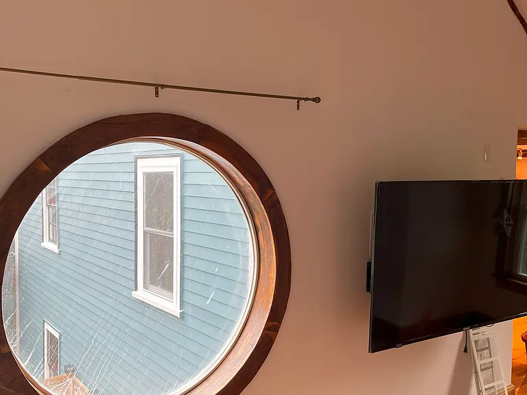 Living Room with Large Round Window