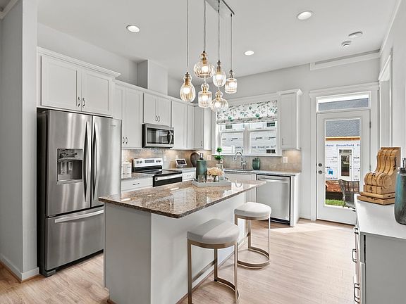 The alternate rear kitchen in the Versailles model at The Crest at Linton Hall by Brookfield Residen