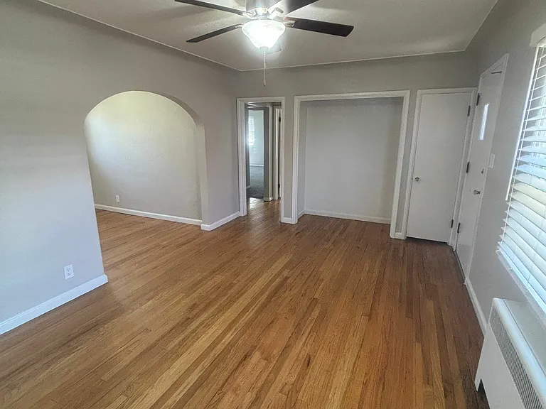 Experience the warmth of this inviting living area, enhanced by elegant hardwood floors and modern lighting. Experience the warmth of this inviting living area, enhanced by elegant hardwood floors and modern lighting.