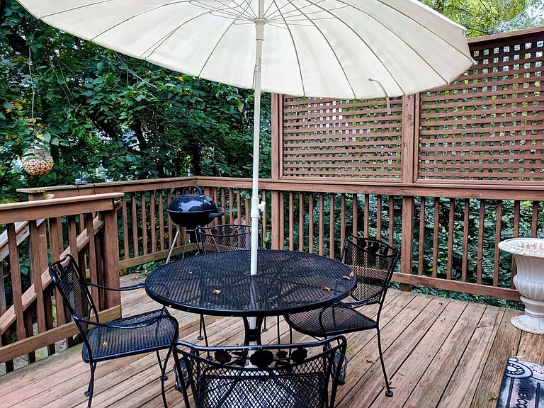 The deck has a stairway down to the yard.