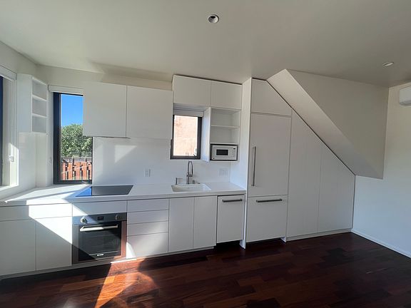 Super efficient kitchen layout with all of the conveniences. Oven, cooktop, microwave, dishwasher, built in fridge.