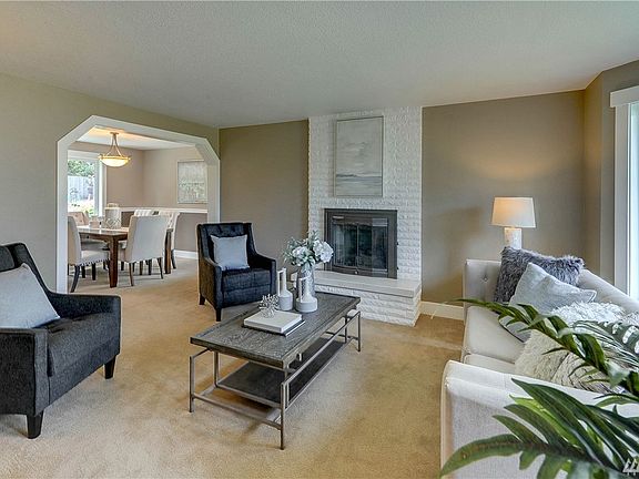 Formal living room is open and bright. 