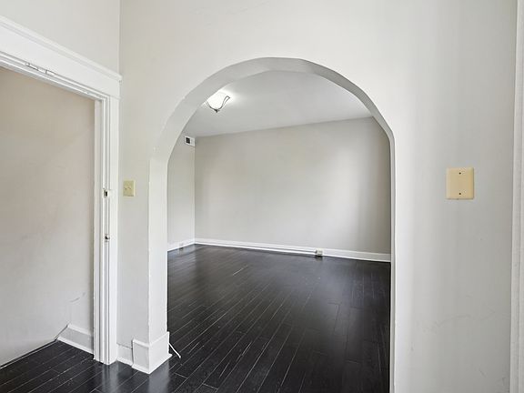 Welcoming foyer opens into a spacious living room.