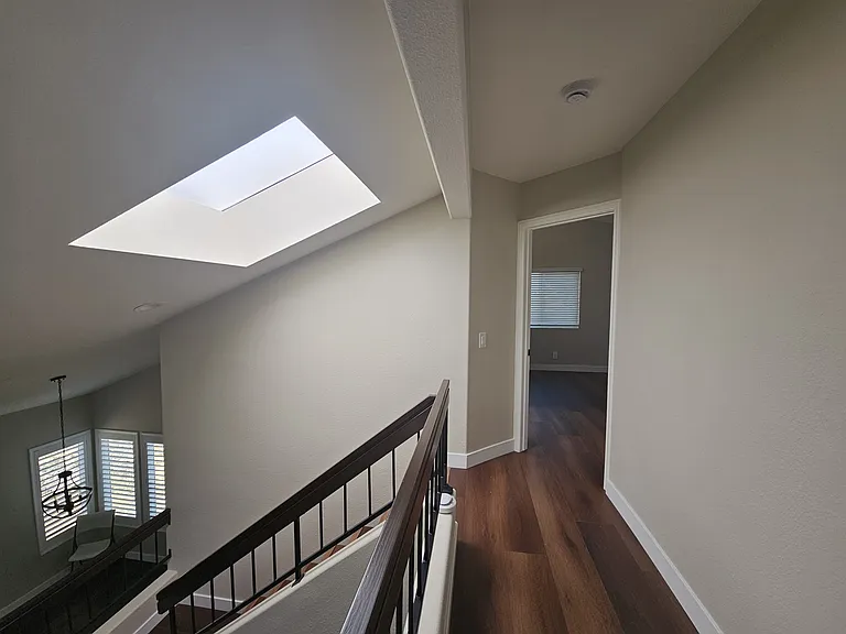 Upper hall looking at Master bedroom. New energy-efficient skylights for natural lighting.