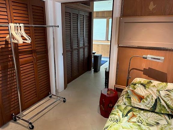 Pocket sliding door divides sleeping from sitting area.