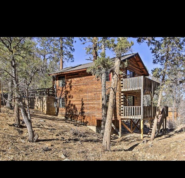 Lower property view of log house
