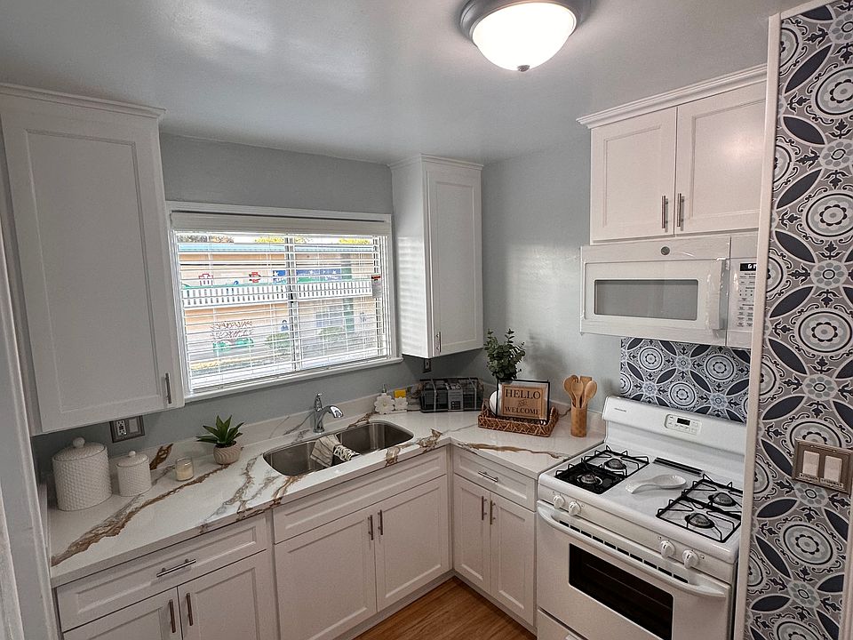 Custom Kitchen with quartz countertop and appliances.