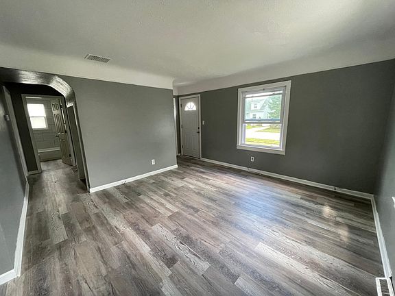 Living room and hallway to bedroom, bathroom, and kitchen.