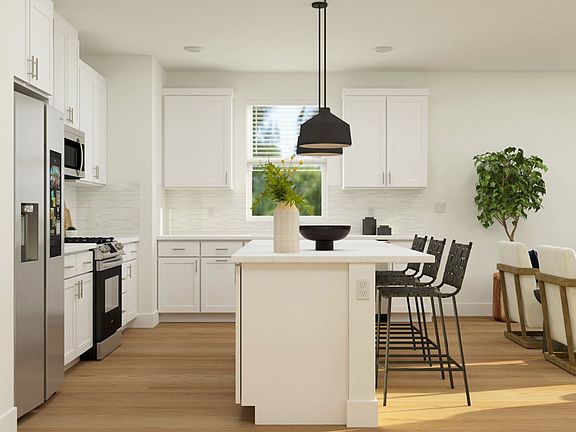 Virtually staged photo of kitchen overlooking the living room