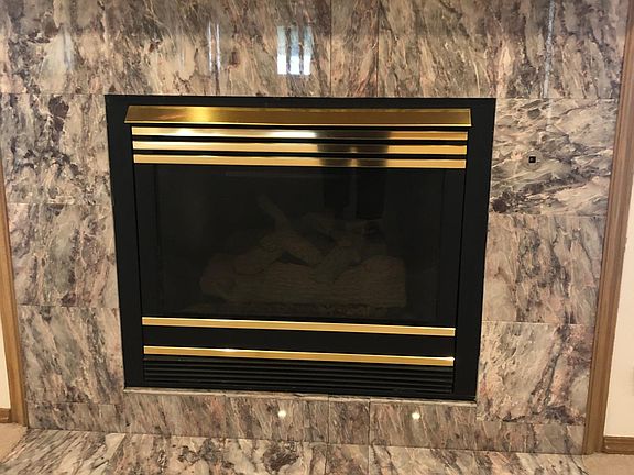 Remote-control gas log fireplace.