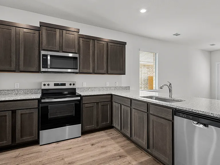 The kitchen has a wonderful breakfast bar.