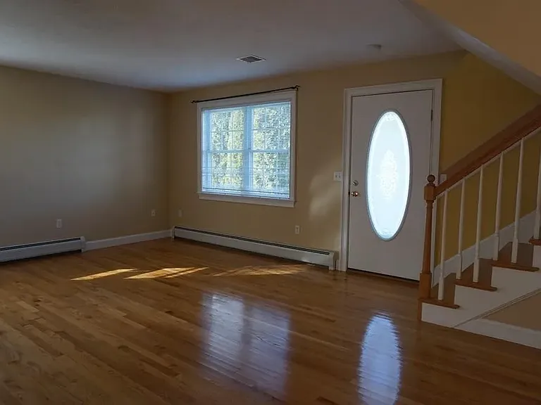 View of livingroom from the kitchen. This area has been painted amore neutral color