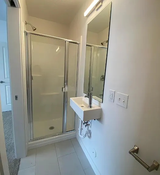 Bathroom #1: Full bathroom from first floor (shower, sink, and toilet)
