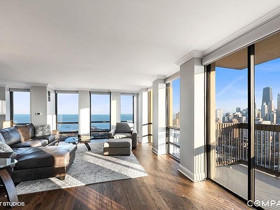 Spacious living area with views of the lake and city
