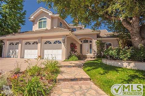 With tremendous curb appeal, this north shore family home sits at end of culdesac in gated community