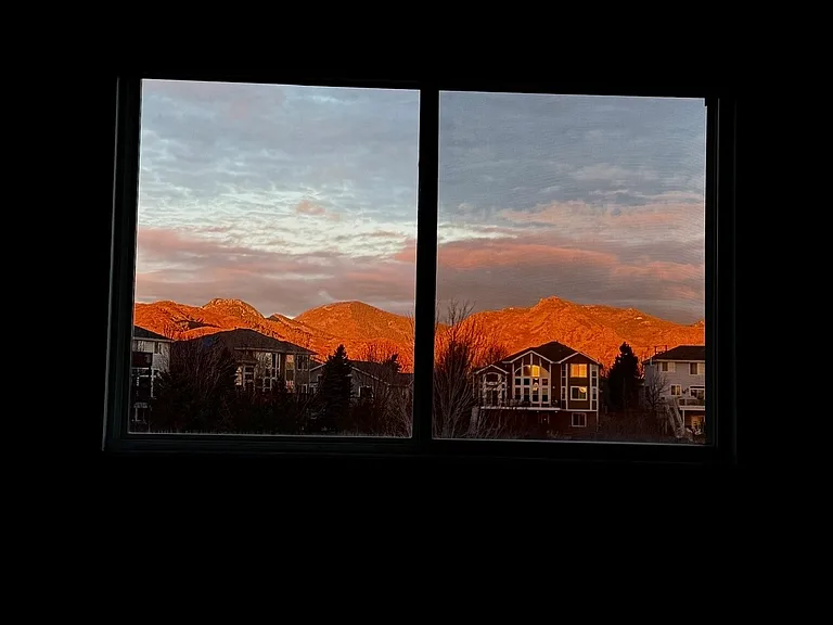 Alpen Glow on the mountains from the primary bedroom window in the mornings, stunning sight to witness
