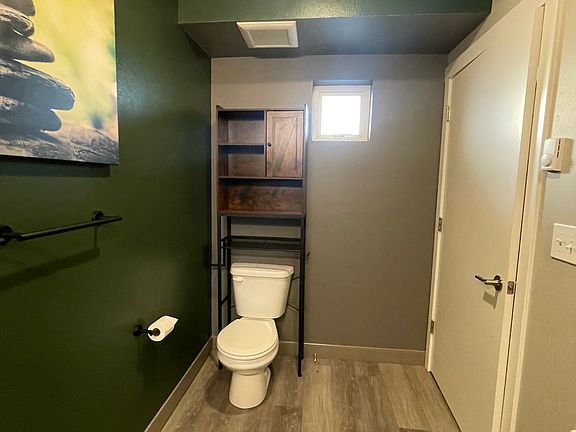 The bathroom, inside the condo to the right