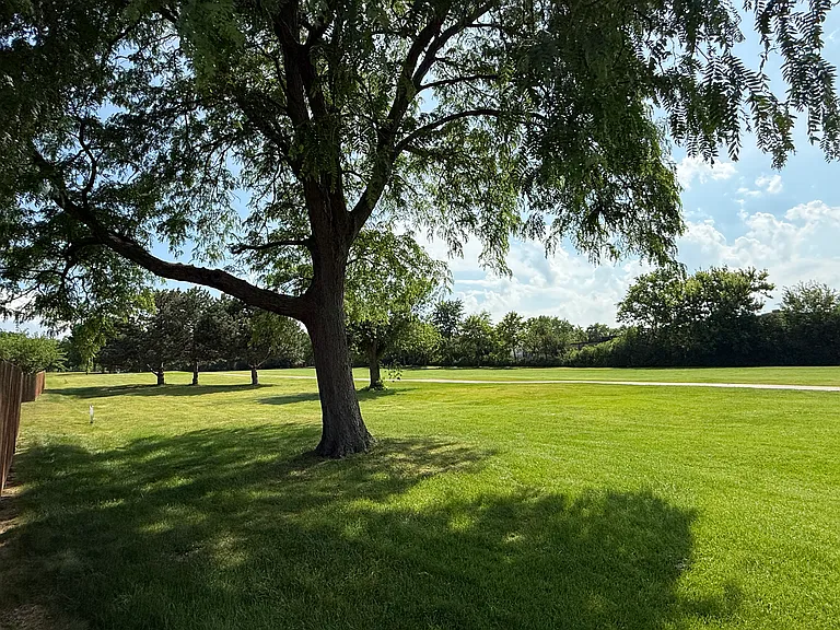 Enjoy scenic green views and walking paths just steps from your front door