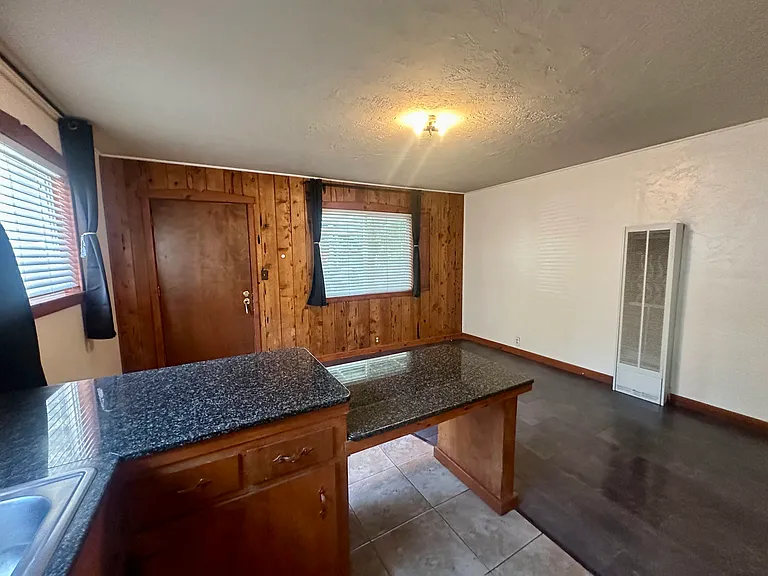 Vintage wood and granite counter tops combine for fresh update