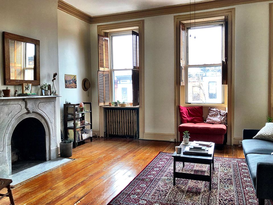 Living room facing west side of street for incredible afternoon light. Wooden shutters if you prefer less light.