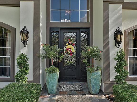 Beautiful front door and landscaping.