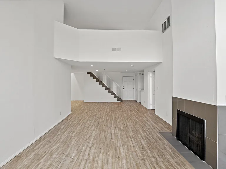 Spacious Living Room with Fireplace and Vinyl Flooring