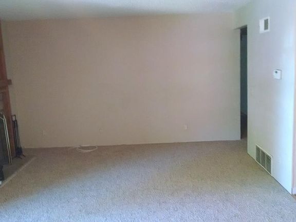 Spacious living room with fireplace