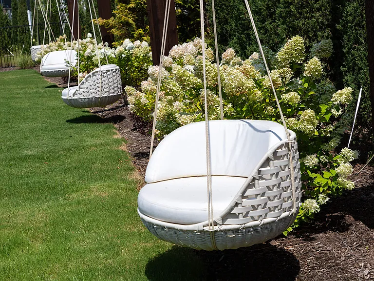Cozy Hanging Basket Chairs at Harpeth Heights Nestled in Lush Garden Setting