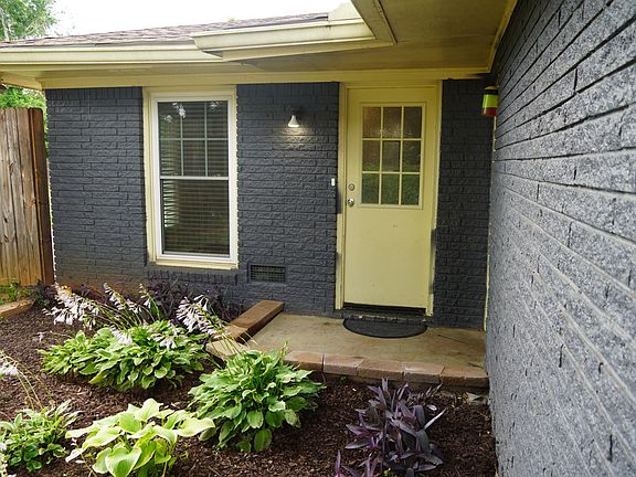 Side-door entrance next to covered car-port, leading into kitchen (2/2)