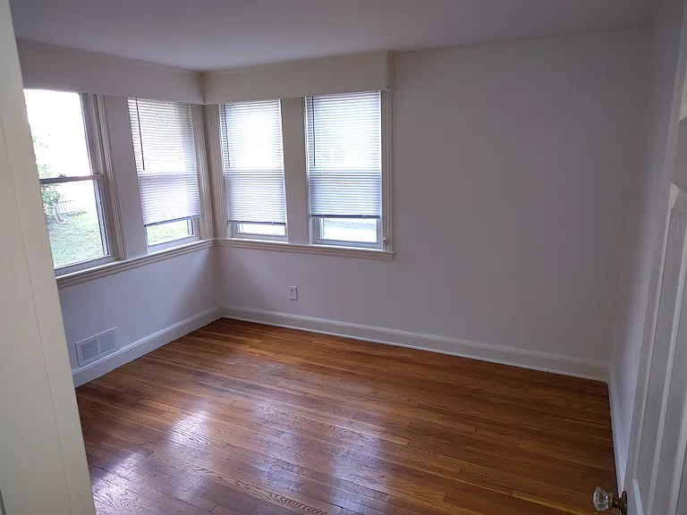 Second bedroom showing back and side windows.