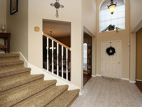 Grand two story bright entry open to formal dining and living.