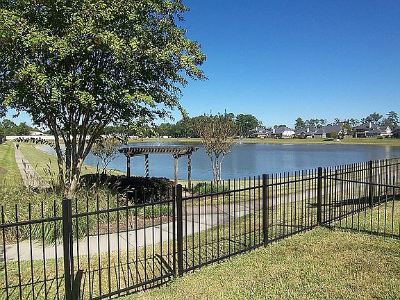 Lake front with views and relaxing sounds of water fountains.