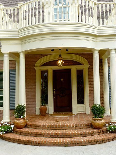 Elegant front entry with fluted columns