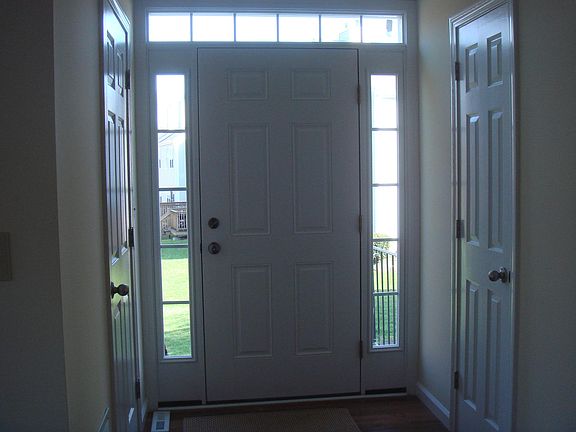 Front Door and Foyer - Closet on Left, Half Bath on Right