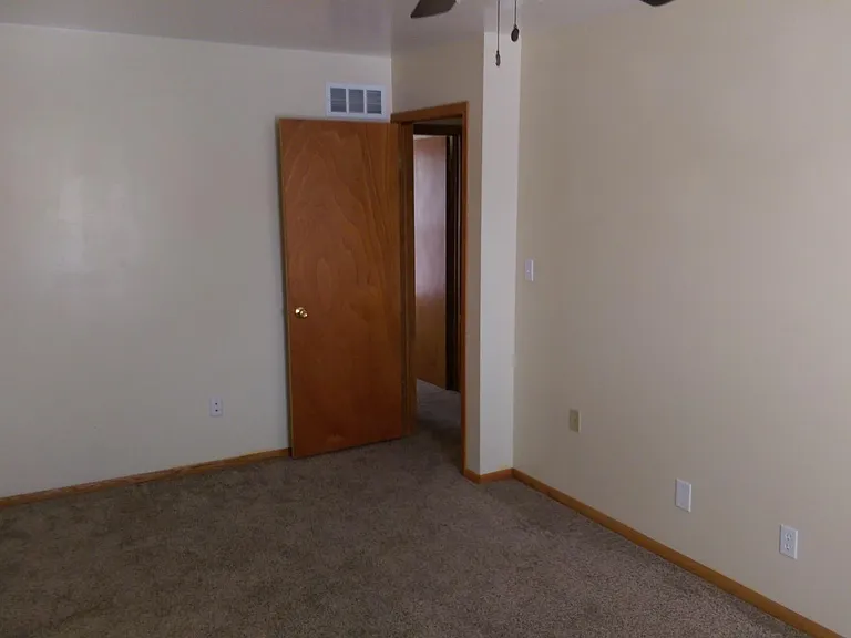 Main bedroom view towards entry door