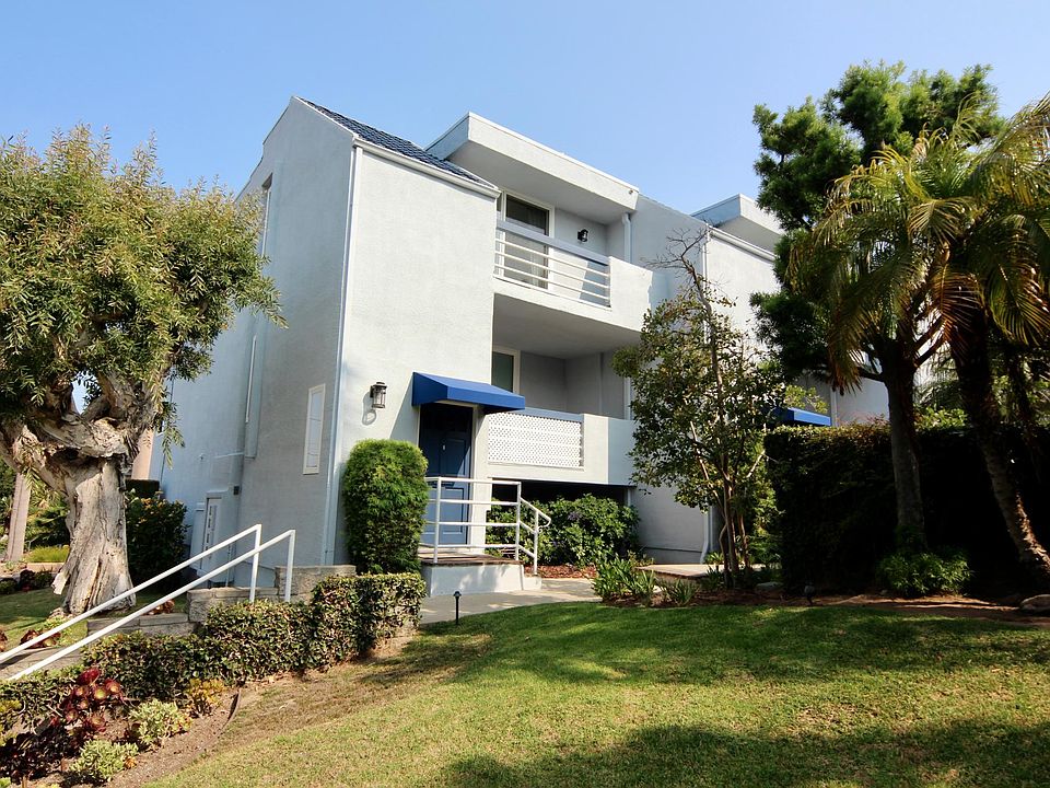 Front door which highlights 2 of the 3 balconies (end unit, sharing just 1 wall)