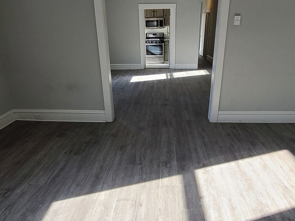 Large living room and dining room - open floor layout throughout the living area - new paint to be completed prior to 3/1 move-in date