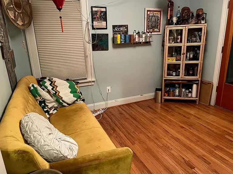 Main floor bedroom with glass exterior door to backyard