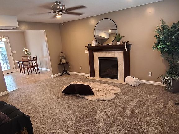 Living room view to dining room & towards back doors.