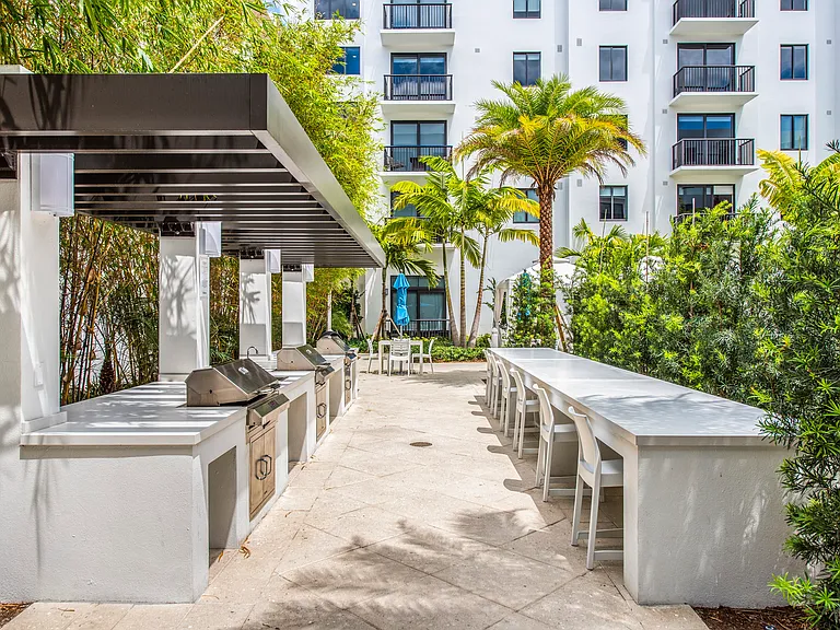 Outdoor grilling stations and dining areas make entertaining effortless.