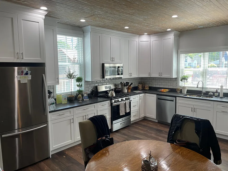High end kitchen with stainless appliances, granite counters, custom cabinets and plenty of natural light.