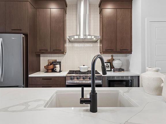 A photo of the kitchen of the Kendal laned model by Brookfield Residential