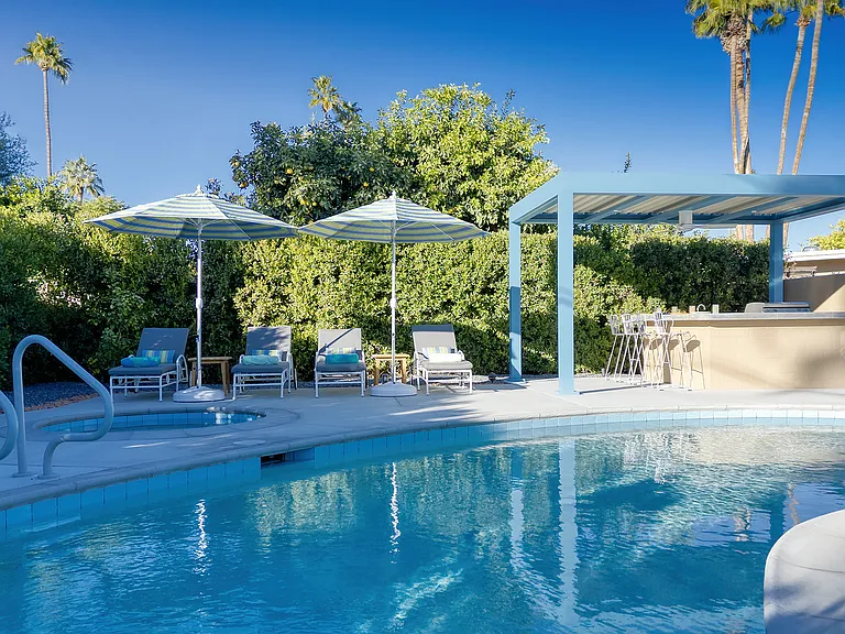 Completely renovated pool with deep end and new spa, refurbished vintage loungers and outdoor kitchen.
